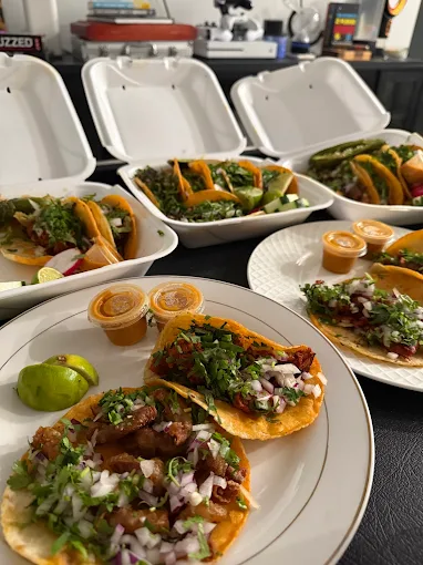 Al Pastor tacos with fresh pineapple and salsa verde from Brothers Taquizas — al pastor tacos in Riviera Beach